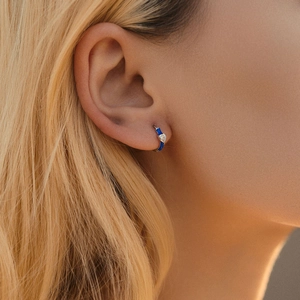 S925 Sterling Silver blue enamel heart earrings with sparkling crystals worn by a model