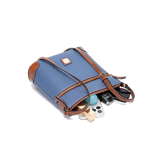 Top view of pebble leather crossbody bag showing interior space for phone and keys