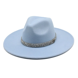 Close-up of sky blue wool felt fedora featuring a silver sequin band and 'M' metal logo