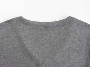 Detailed view of the V-neckline and fine knitted texture of this gray slim fit T-shirt