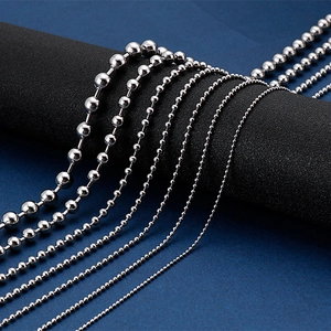 Sleek stainless steel ball bead necklaces in various sizes on a black display stand