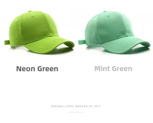 Close-up of neon and fruit green cotton baseball caps with metal adjustment buckles