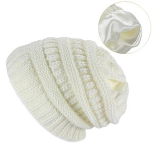 Winter knit beanie in cream white with soft satin lining for warmth and hair care