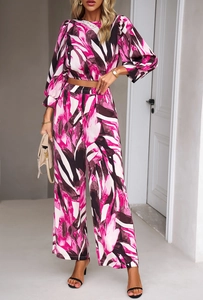 Detail of pink abstract floral print on lightweight two-piece crop top and pants set