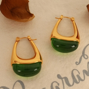 Retro gold U-shaped earrings with large translucent dark green resin cabochon drops