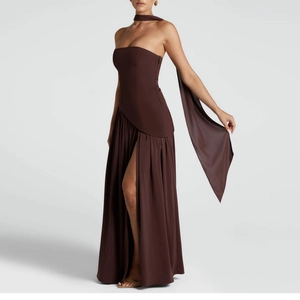 Detail of chocolate brown strapless evening dress with waist cut-out and high slit