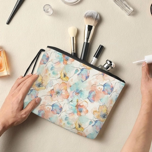 Portable floral makeup bag with colorful flower pattern and convenient side wristlet strap