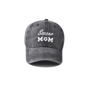 Detailed view of Soccer MOM embroidery on a vintage washed charcoal denim baseball cap