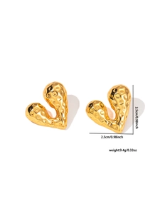 Detailed view of hammered gold heart earrings showing 2.5cm size and textured finish
