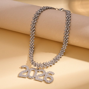 Detailed close-up of a silver-toned necklace with a sparkling 2026 numeric pendant