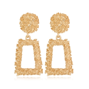 Detail of gold geometric earrings featuring hammered texture and a rectangular frame design