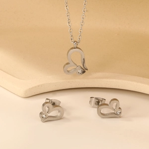 Elegant heart-shaped necklace and stud earrings jewelry set with white crystals
