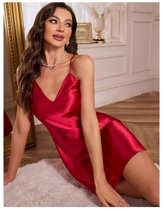 Close-up of red satin nightdress with V-neckline and delicate thin shoulder straps