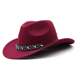 Detail of maroon wool cowboy hat with handcrafted beaded leather band and curved brim