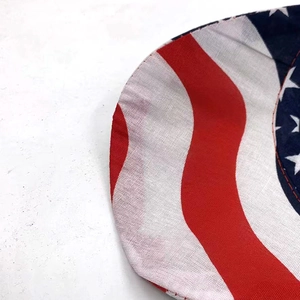 Macro shot of durable canvas fabric with American flag pattern on sun hat brim