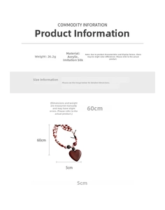 Detail view of heart pendant with red checkerboard fabric cord weighing 26.2g
