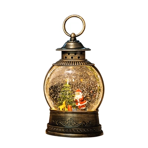 Vintage bronze Christmas lantern with Santa Claus and glitter snow globe effect