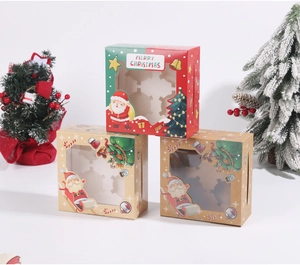 Detail of Christmas cupcake boxes with clear windows and 4-hole inserts for desserts