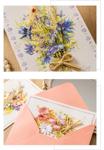 Detail view of handmade dry flower greeting cards with elegant envelopes and ribbon bows
