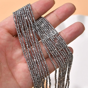 Macro shot of 2mm dark grey faceted crystal glass beads for DIY jewelry making