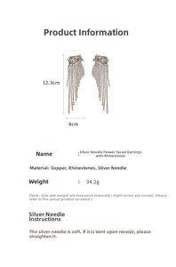 Detail showing oversized silver flower tassel earrings with rhinestone 12.3cm length specs