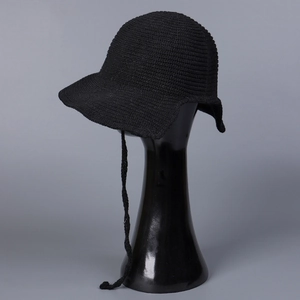 Close-up of black breathable knit sun hat featuring ear flaps and ties on a mannequin