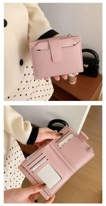 Detail of pink bifold wallet featuring snap button closure, zipper pocket and card slots