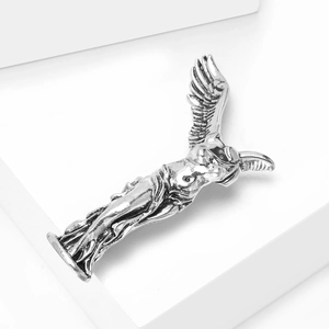 Close-up of vintage silver Winged Victory brooch with intricate antique finish details