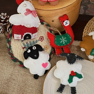Handmade felt Christmas tree hanging ornaments featuring sheep, alpaca, and mini house