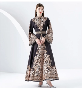 Detail of floral baroque print on a vintage-style long dress with a high collar design