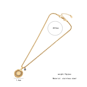 Detail shot of golden stainless steel necklace with blue evil eye charm and size specs