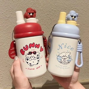 Detail of insulated cartoon water bottle featuring a 3D puppy charm and silicone handle