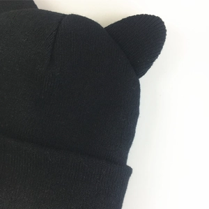 Black knitted beanie hat with cute cat ear design for women in casual winter style