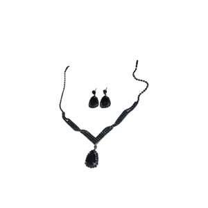 Elegant black teardrop crystal jewelry set including necklace and earrings on white background