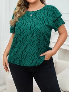 Detail of plus size summer top featuring green leopard print and ruffled flutter sleeves