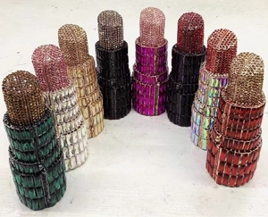 Lipstick-shaped evening clutch bags in multiple colors with full rhinestone embellishment