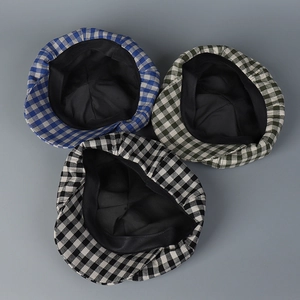 Unisex retro linen newsboy caps with vintage checkered patterns in blue green and black
