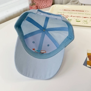 Detail view of breathable light blue mesh back and adjustable snapback on kids sun cap
