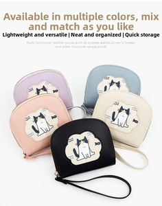 Group display of cat-themed wallets in five colors with wristlets and zipper closures