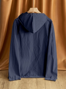 Detailed texture of navy linen hooded shirt featuring a clean button-down design