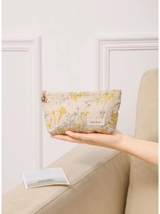 Trousse à maquillage en coton et lin avec broderie florale jaune et tirette fleurie