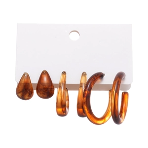 Set of 3 pairs amber resin earrings including teardrop, hoop, and round stud designs