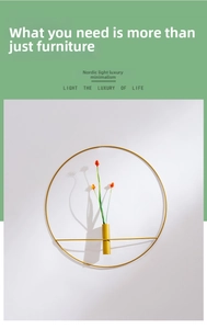 Close-up of golden circular metal wall vase with a slender tube holding orange dried flowers