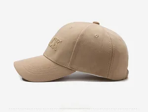 Detail of 3D LUCK letter embroidery on breathable beige baseball cap side profile