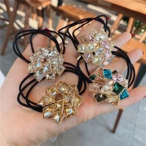 Sparkling crystal flower hair ties with rhinestones and black elastic cord for women