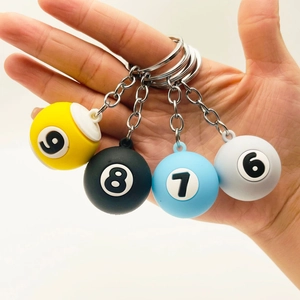 Mini billiard ball keychains in yellow, black, blue, and grey colors with numbers 6 to 9