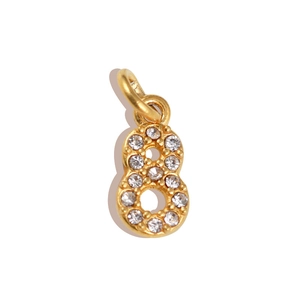 Macro shot of gold number 8 pendant with micro-pave white rhinestones for jewelry DIY
