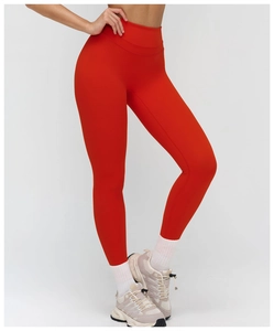 Detail of red high-waisted yoga leggings showing high elasticity fabric and slimming fit