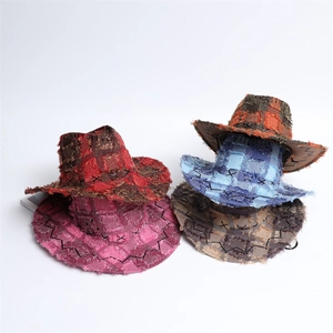 Checkered western cowboy hats in red, pink, and blue with vintage frayed edges