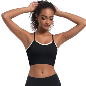 Detail of black sports crop top with white contrast piping and elastic knit fabric